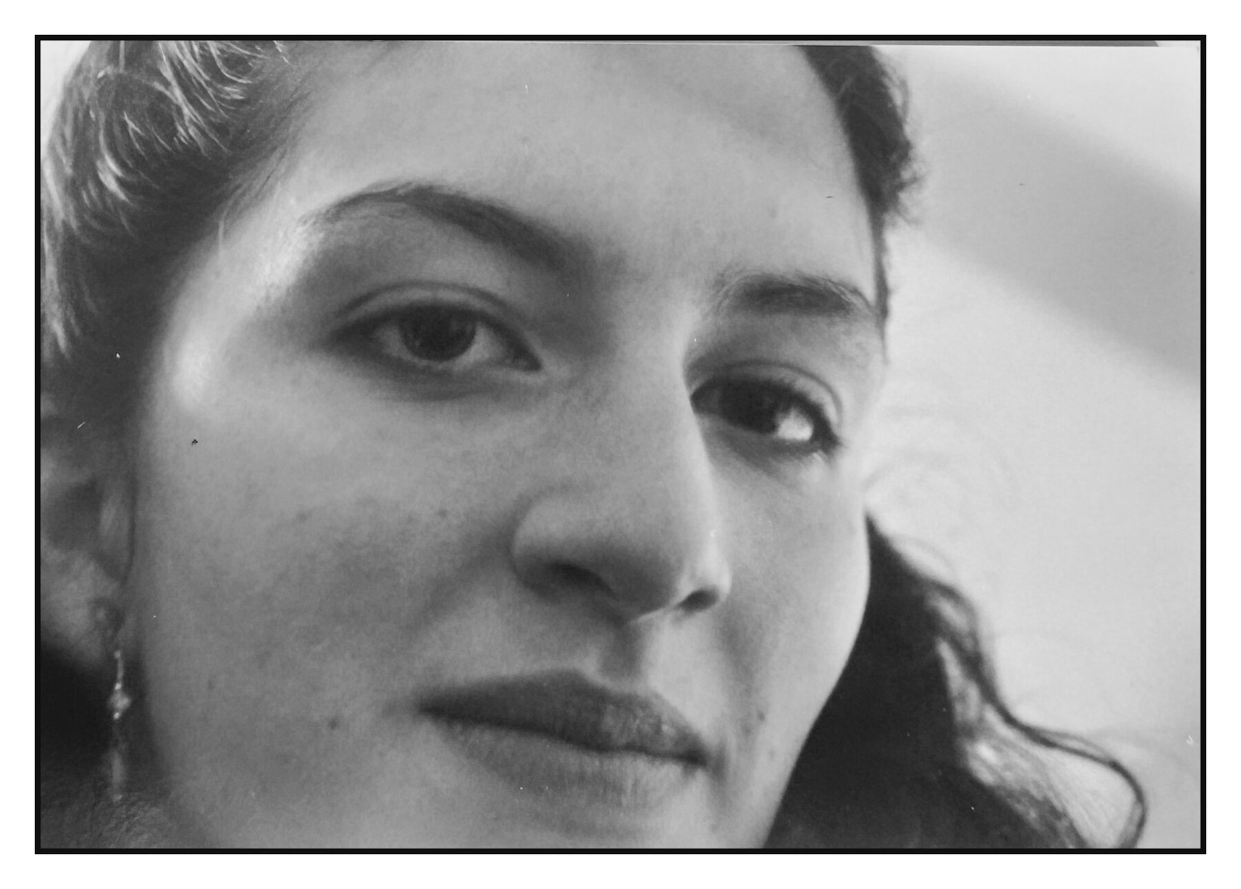 Close black-and-white portrait of a woman